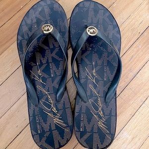 Michael Kors, size 8 woman’s, heeled flip flops.